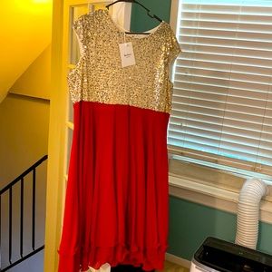 New with tags! Gold sequinced with red on bottom half, size 20, sleeveless dress